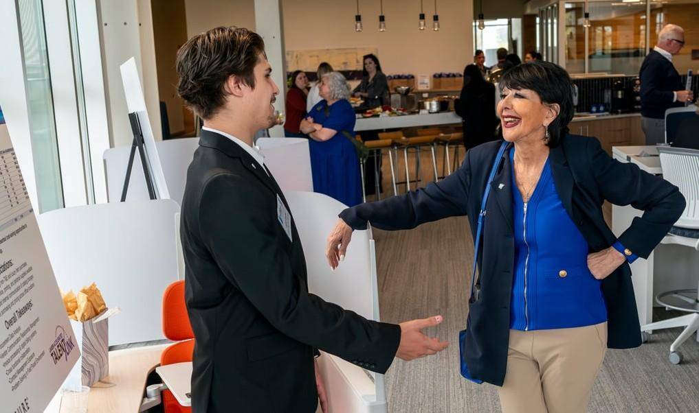 President Mantella speaking with a participant at the LATL.